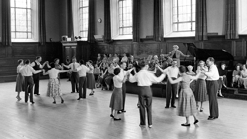 historical photo of a busy social dance in Kennedy Hall